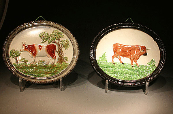 ANTIQUE STAFFORDSHIRE POTTERY PLAQUES OF A BULL AND COW C1820