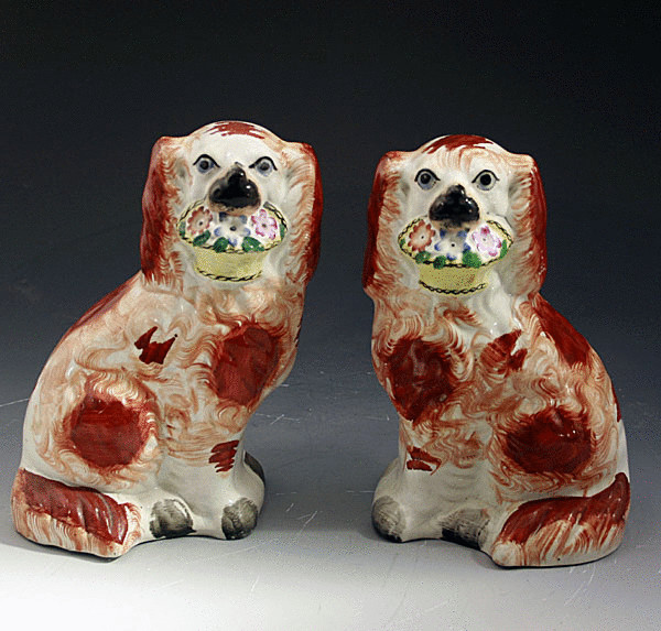 PAIR ANTIQUE STAFFORDSHIRE POTTERY SPANIELS WITH BASKETS
