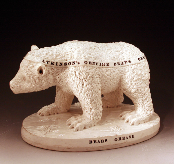 Staffordshire pottery figure advertising Bears Grease.