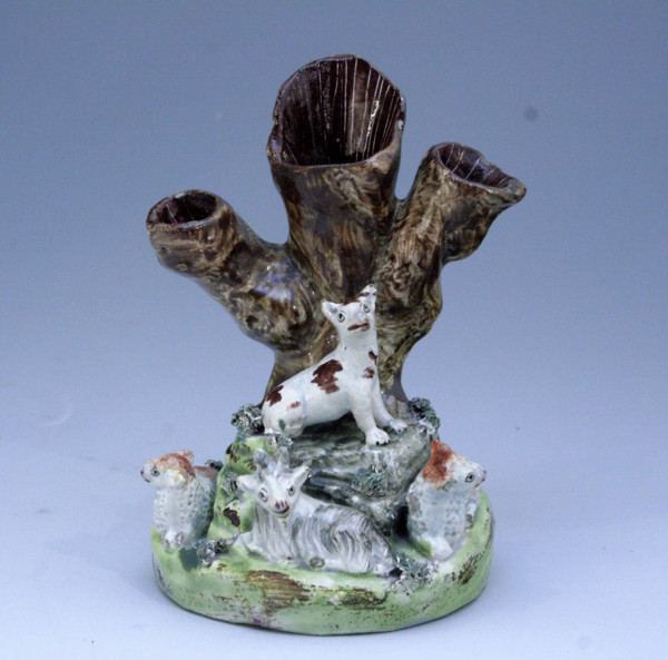 Staffordshire figure tree trunk group with animals