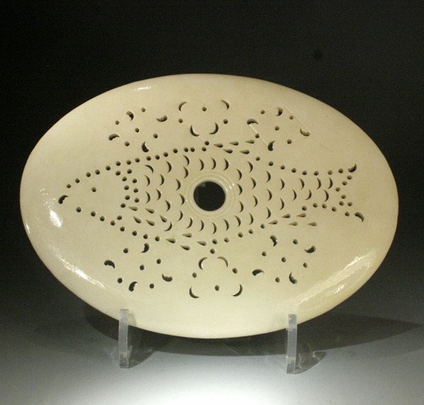 ENGLISH PLAIN CREAMWARE POTTERY DRAINER WITH A FISH