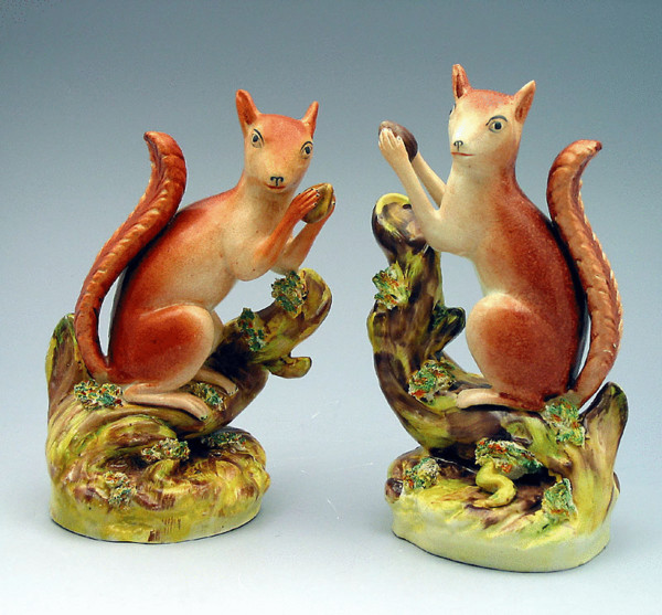 Pair Staffordshire pottery figures of Squirrels eating nuts. c1850
