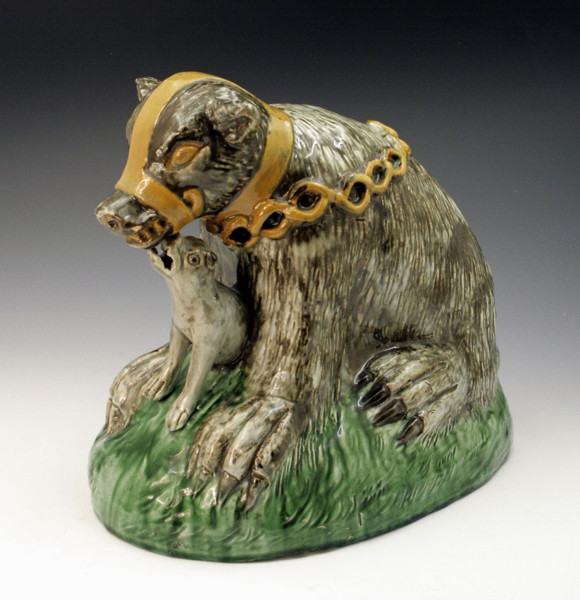 CREAMWARE POTTERY BEAR BAITING FIGURE WITH COLOURED GLAZE