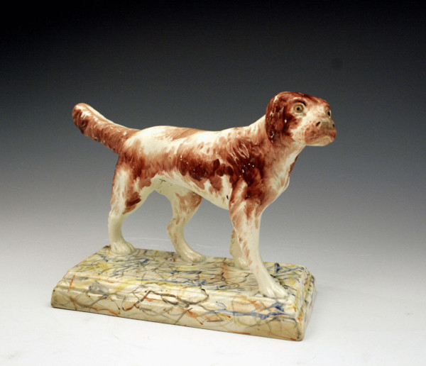 Staffordshire figure of a sporting dog standing on base c1820