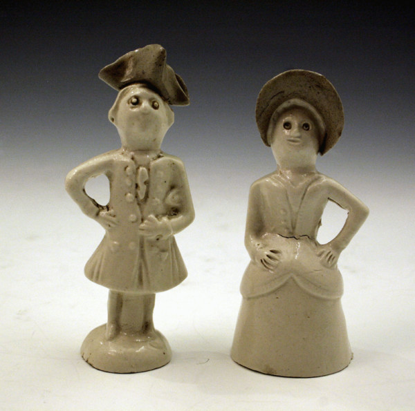 Pair of Staffordshire pottery figures in saltglaze c1750