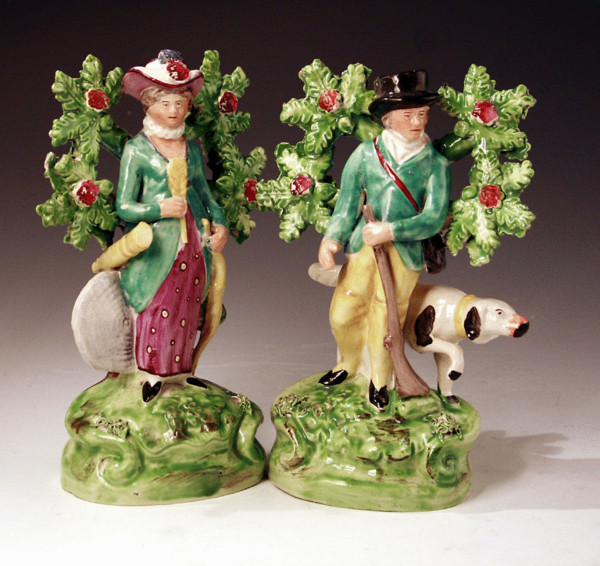 Pair of Staffordshire pottery figures of an archer and sportsman with bocage.