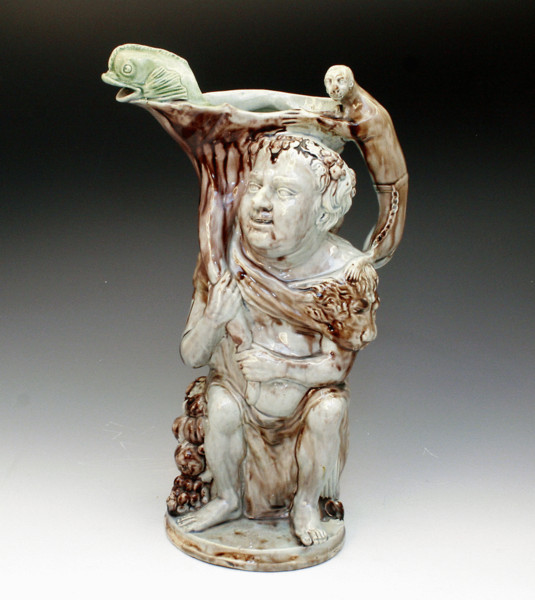 BACCHUS RELIEIF MOULDED STAFFORDSHIRE POTTERY JUG WITH COLOURED GLAZES  