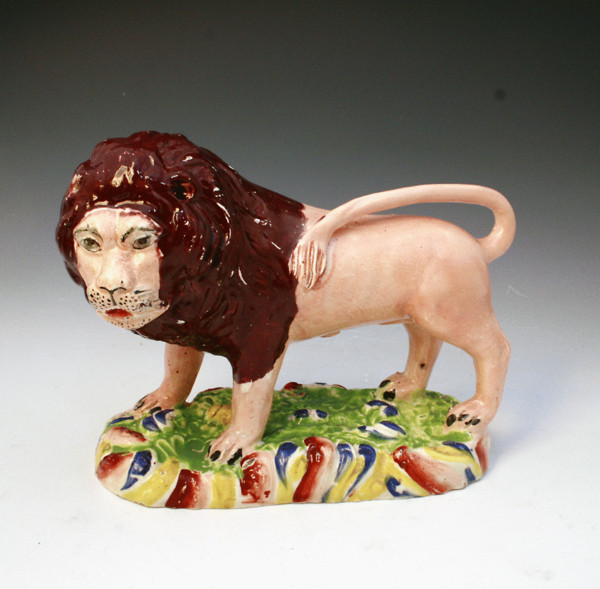 STAFFORDSHIRE POTTERY PEARLWARE FIGURE OF A LION c1825 