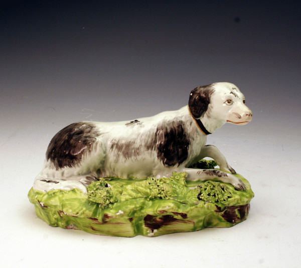 STAFFORDSHIRE POTTERY FIGURE OF A SPORTING DOG C1820