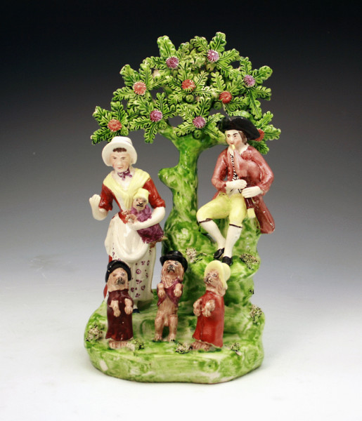 STAFFORDSHIRE POTTERY FIGURE GROUP WITH PERFORMING DOGS
