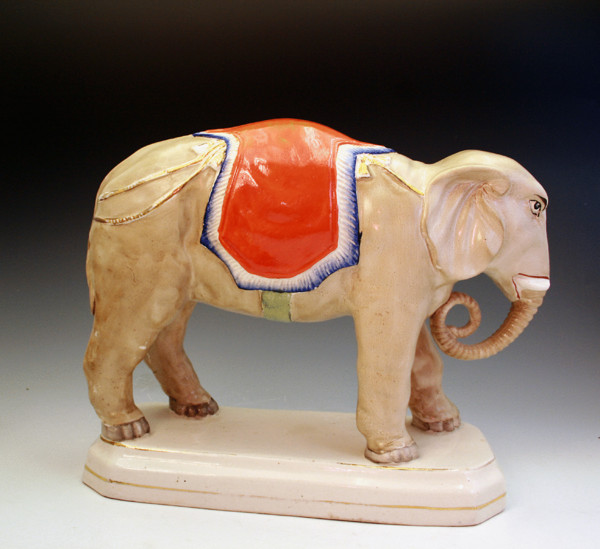 STAFFORDSHIRE FIGURE OF A STANDING ELEPHANT, VICTORIAN PERIOD