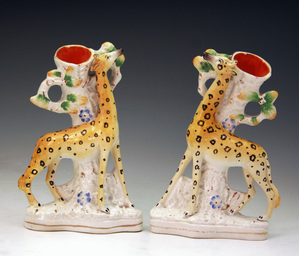 PAIR OF VICTORIAN STAFFORDSHIRE POTTERY FIGURES OF GIRAFFES