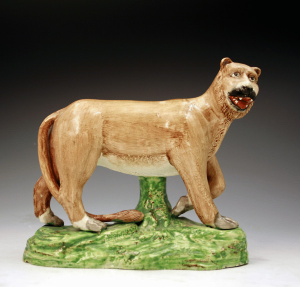 Antique English pottery figure of a standing lion Staffordshire c1820