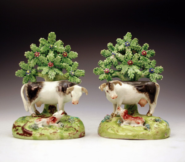 Antique English Staffordshire pottery pearlware figures of cows by Walton.