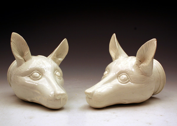 PAIR OF PEARLWARE POTTERY FOX HEAD STIRRUP CUPS
