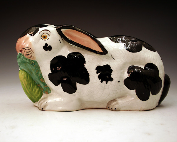 Staffordshire pottery figure of arabbit munching leaves mid 19th century