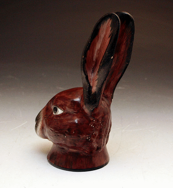ANTIQUE POTTERY STIRRUP CUP IN THE FORM OF A HARES HEAD C1810