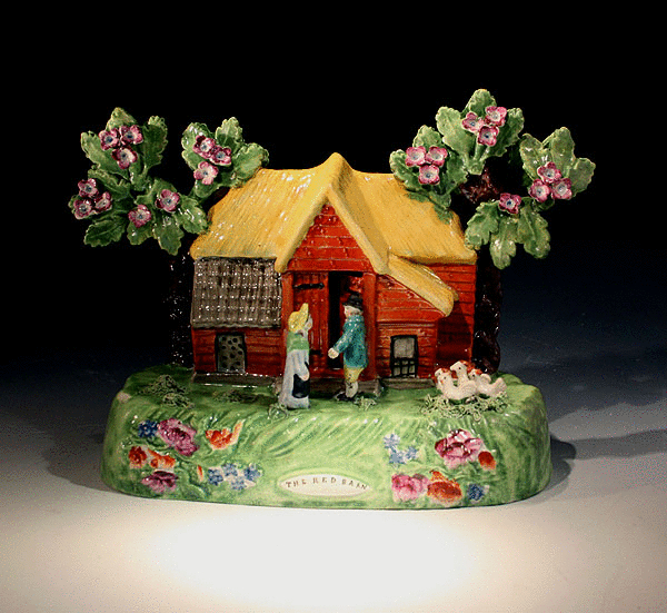 A rare antique Staffordshire pottery figure titled RED BARN. 