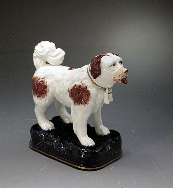 ANTIQUE STAFFORDSHIRE POTTERY FIGURE OF A ST.BERNARD DOG