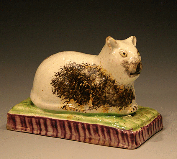 STAFFORDSHIRE POTTERY PEARLWARE FIGURE OF A CAT