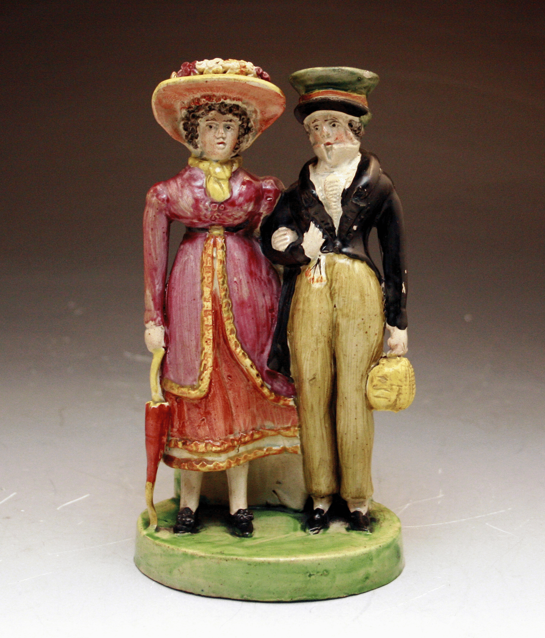 Staffordshire figure group of male and female Dandies.