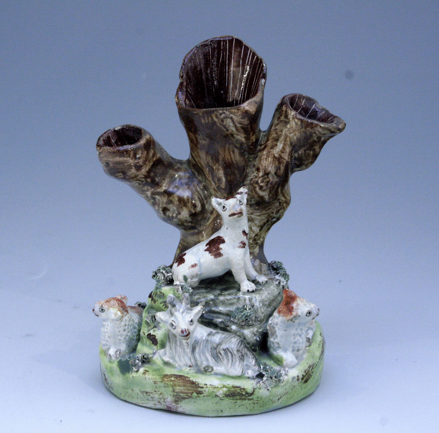 Staffordshire figure tree trunk group with animals
