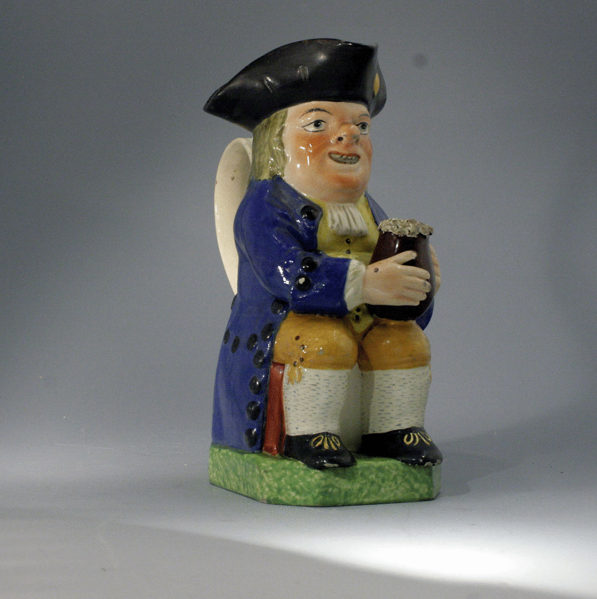 Toby Jug in colored enamels. Staffordshire pottery.