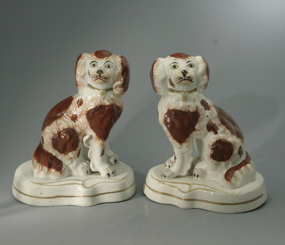 Pair of Staffordshire Spaniel Dogs on bases with best gold decoration