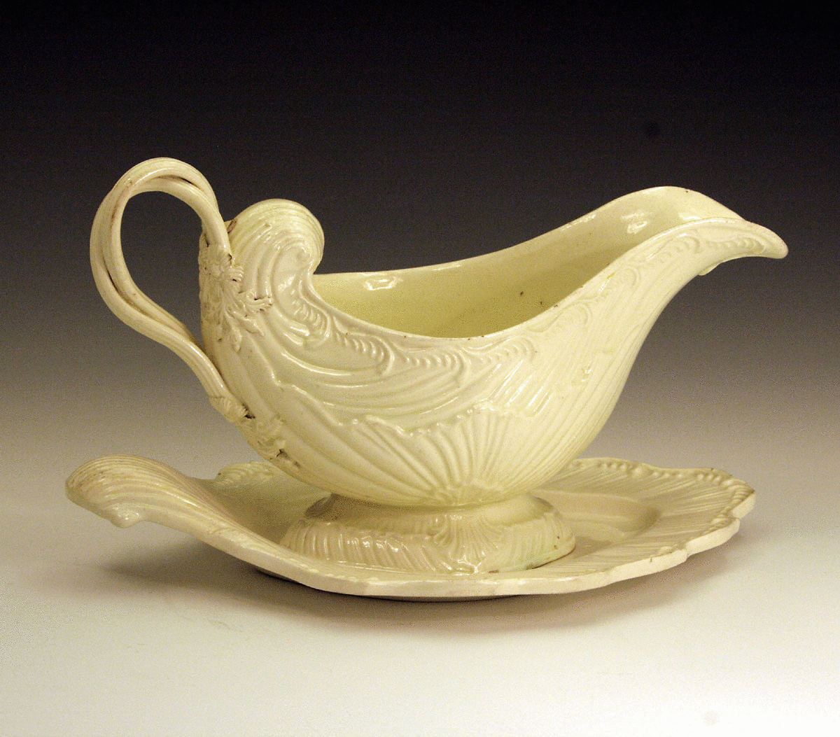 Antique plain creamware pottery sauce boat and stand