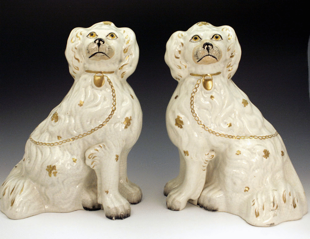PAIR OF STAFFORDSHIRE POTTERY SPANIEL DOGS