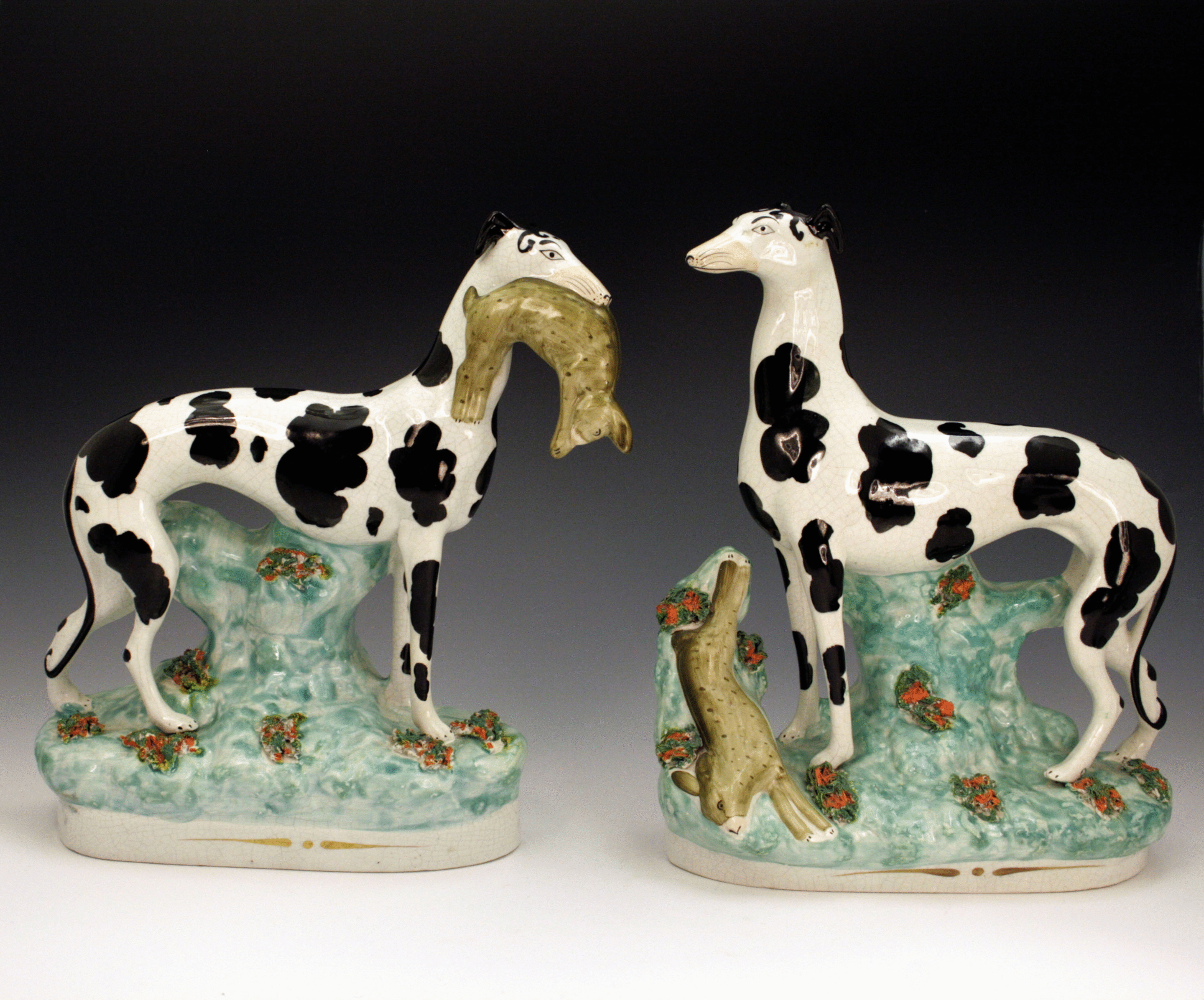 Staffordshire pottery figures of greyhounds