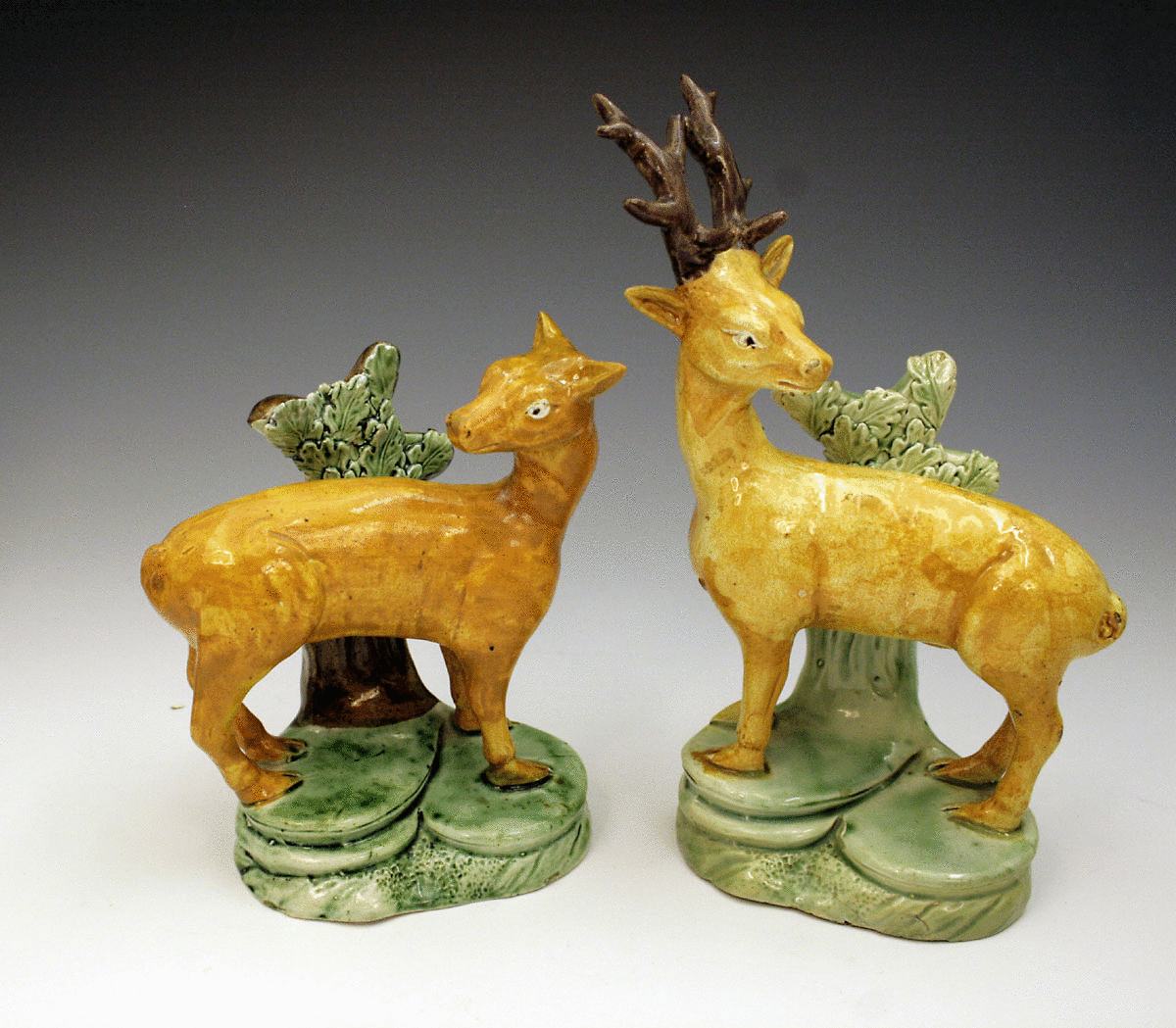 Stag and doe Prattware figures with bocage