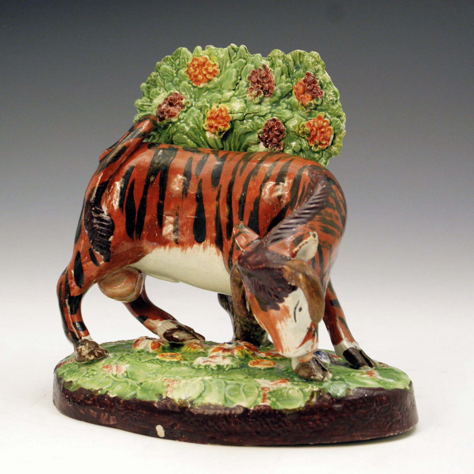 STAFFORDSHIRE POTTERY FIGURE OF A BULL WITH BOCAGE