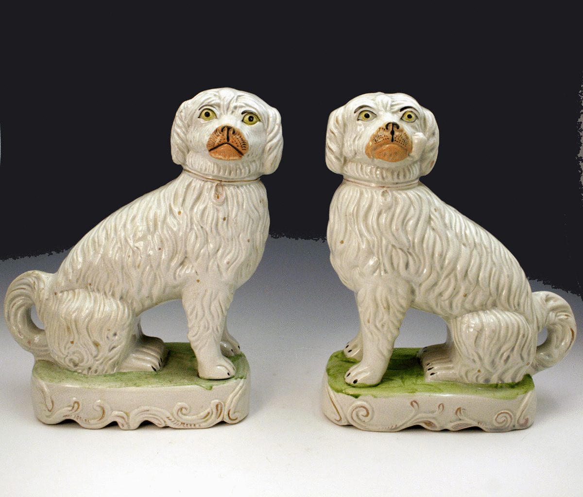 PAIR STAFFORDSHIRE FIGURES OF PIPE SMOKING DOGS