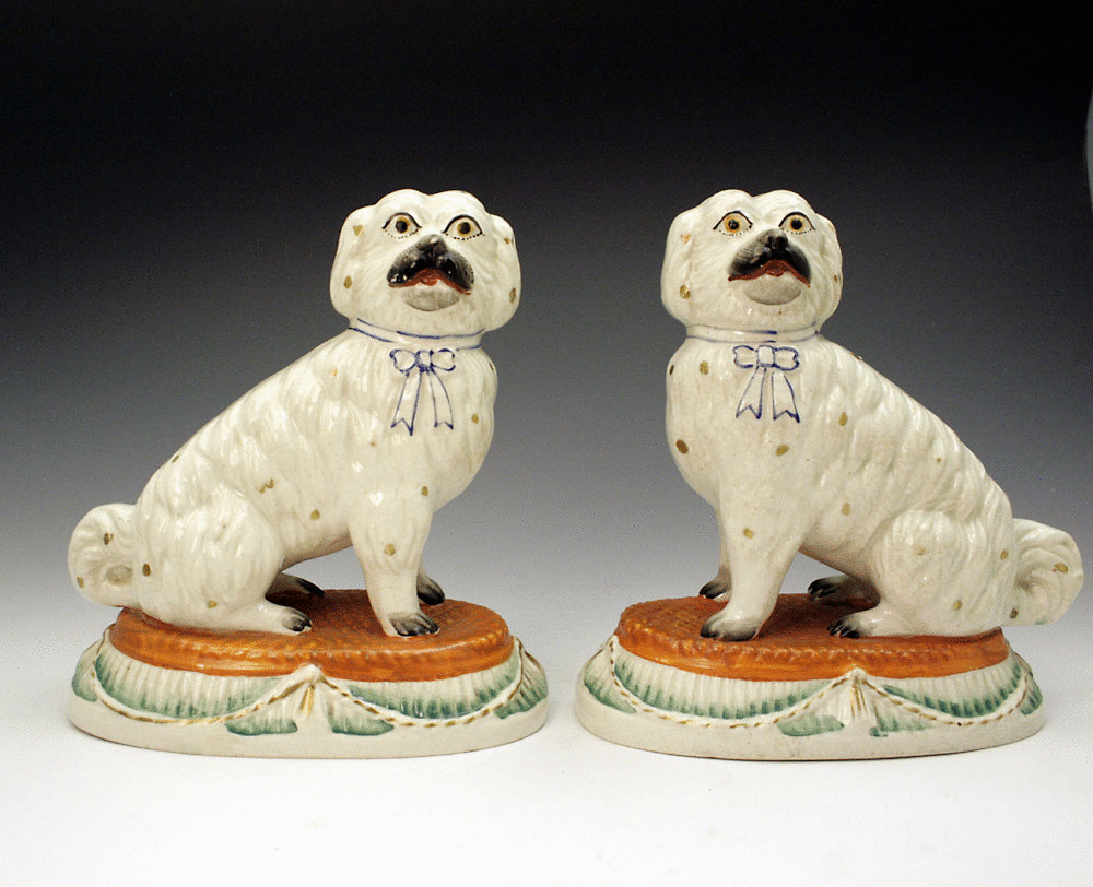 PAIR OF ANTIQUE STAFFORDSHIRE FIGURES OF MALTESE DOGS