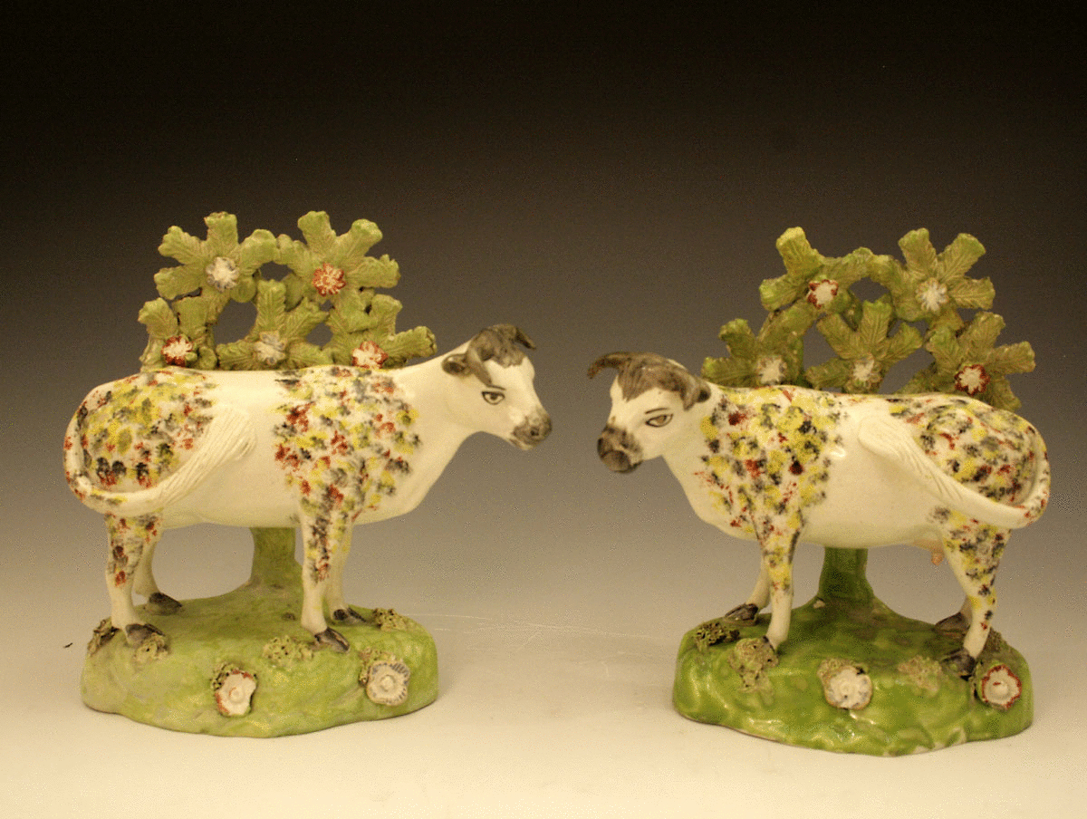 Pair Staffordshire figures of cows with bocage circa 1820
