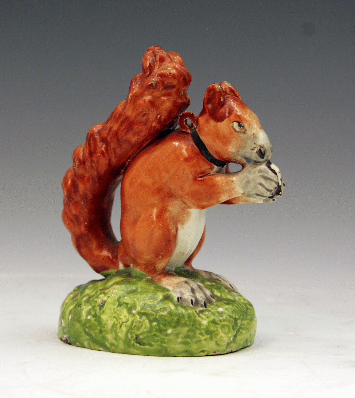 Staffordshire figure of a pet squirrell in pearlware