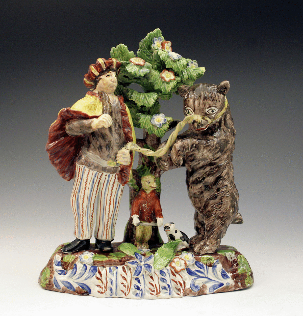STAFFORDSHIRE FIGURE GROUP OF DANCING BEAR AND SAVOYARD