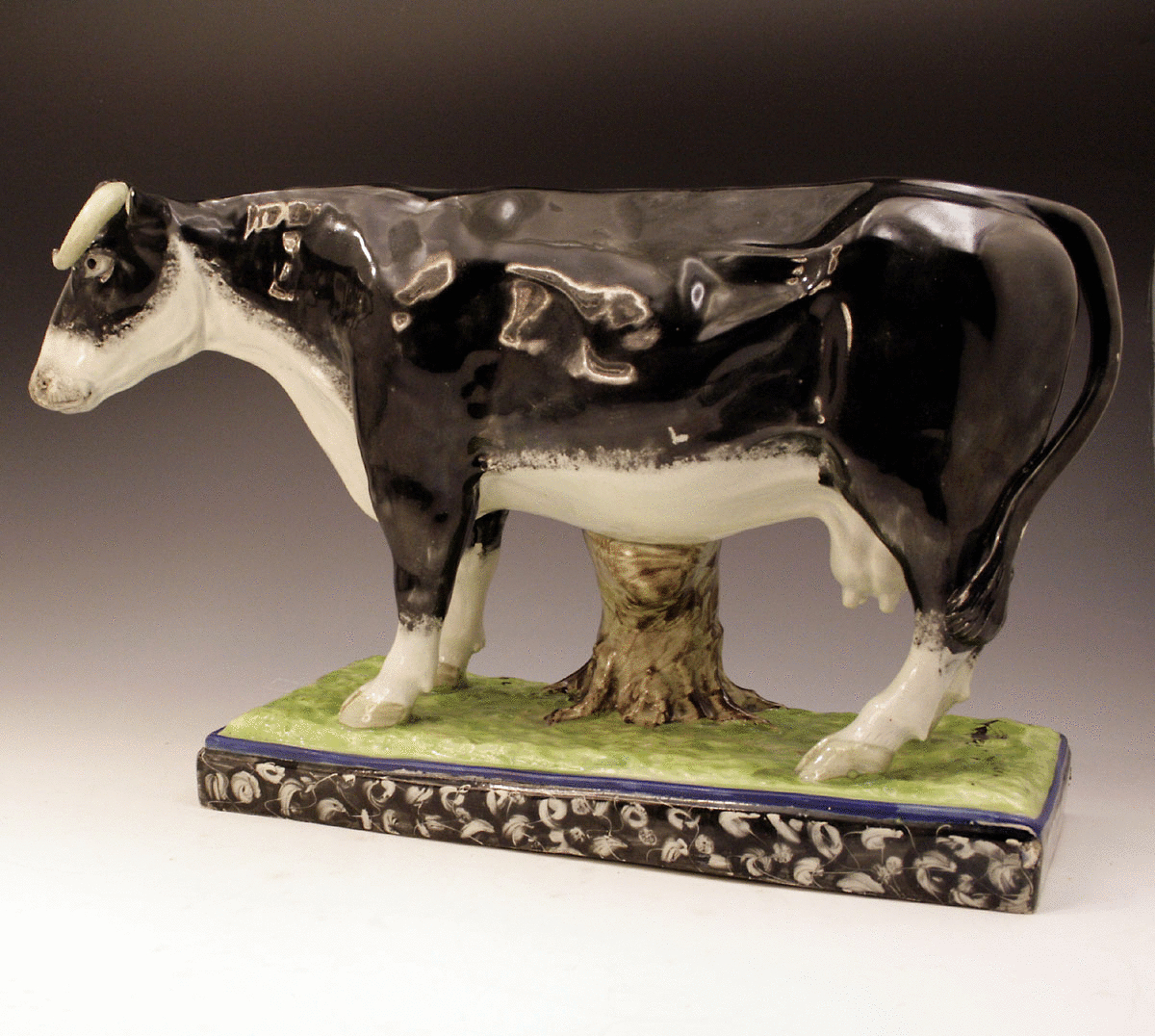 MASSIVE ANTIQUE PEARLWARE ENGLISH POTTERY FIGURE OF A COW.