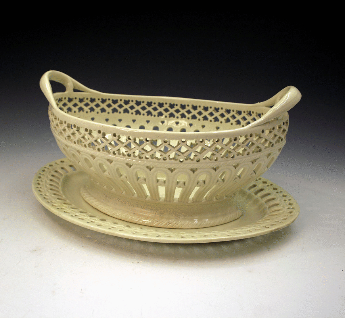 PLAIN CREAMWARE POTTERY BASKET AND STAND SHORTHOSE 