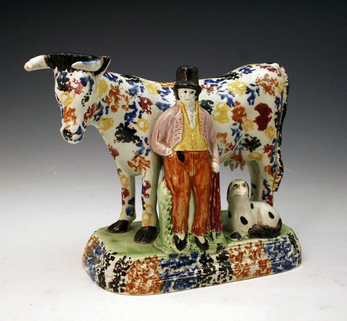 ANTIQUE YORKSHIRE POTTERY FIGURE OF A COW AND FARMER