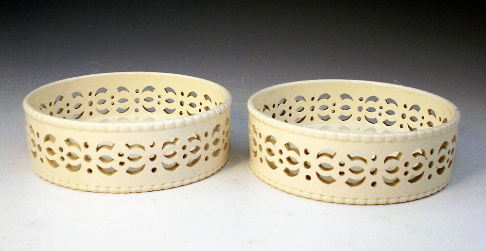 Pair Wedgwood undecorated plain creamware pottery wine coasters.