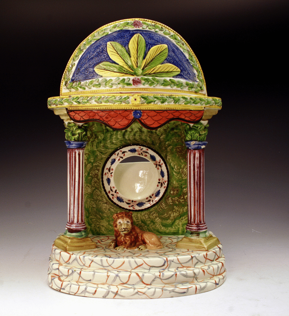 PEARLWARE WATCH HOLDER WITH FIGURE OF A LION.c1820