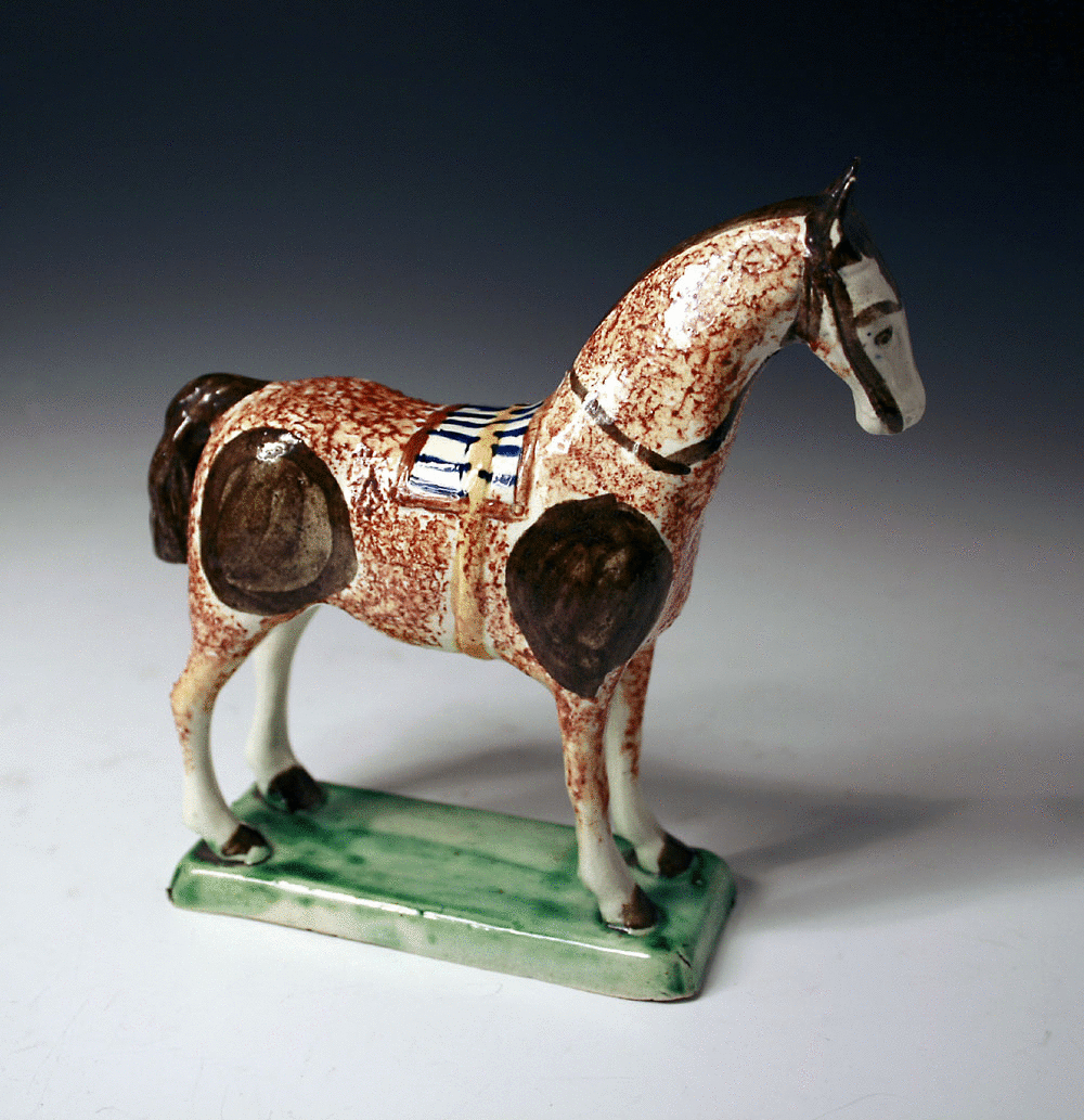 English pottery prattware figure of a standing horse on base 