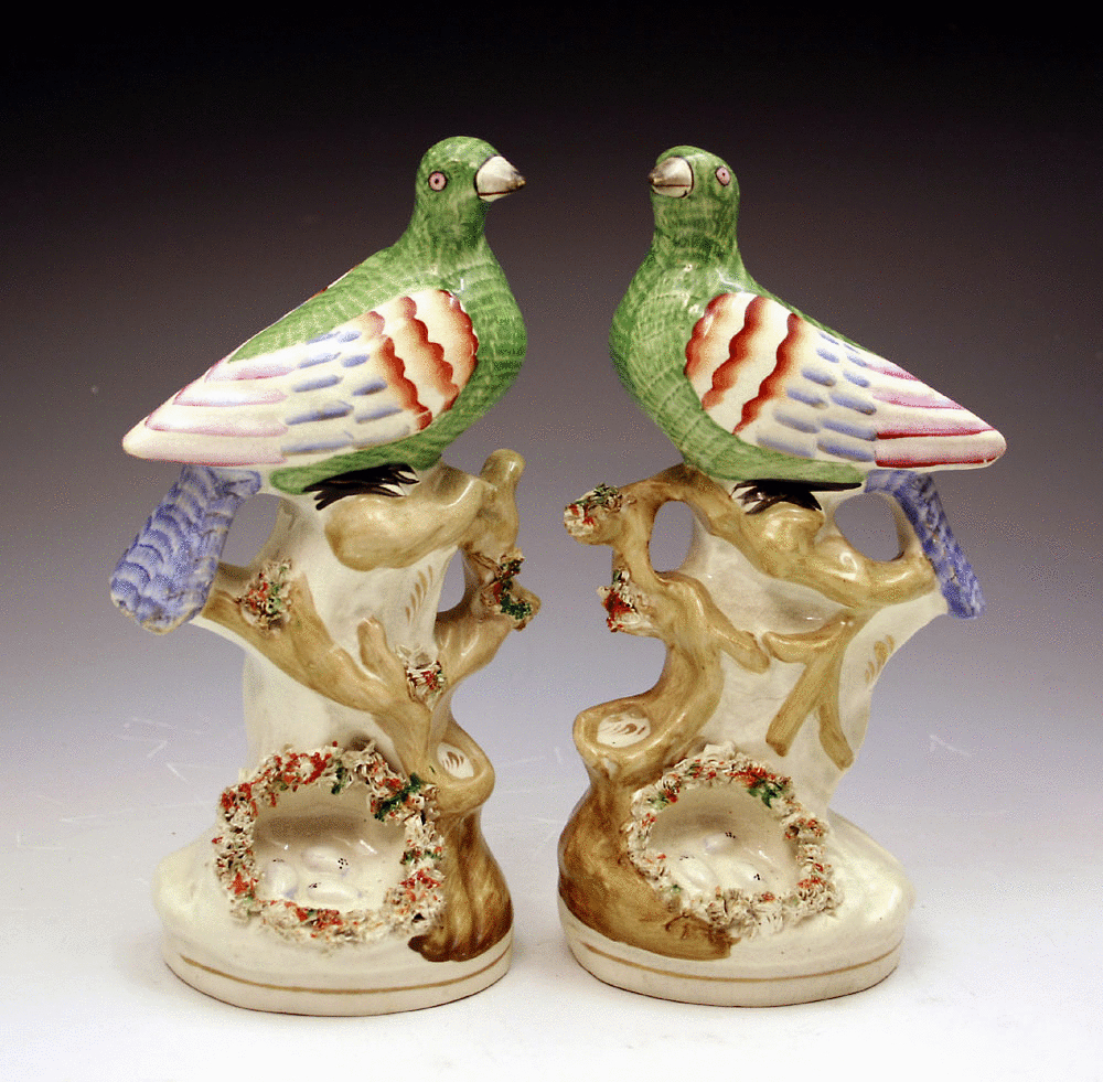 Pair antique Victorian Staffordshire pottery figures of exotic birds