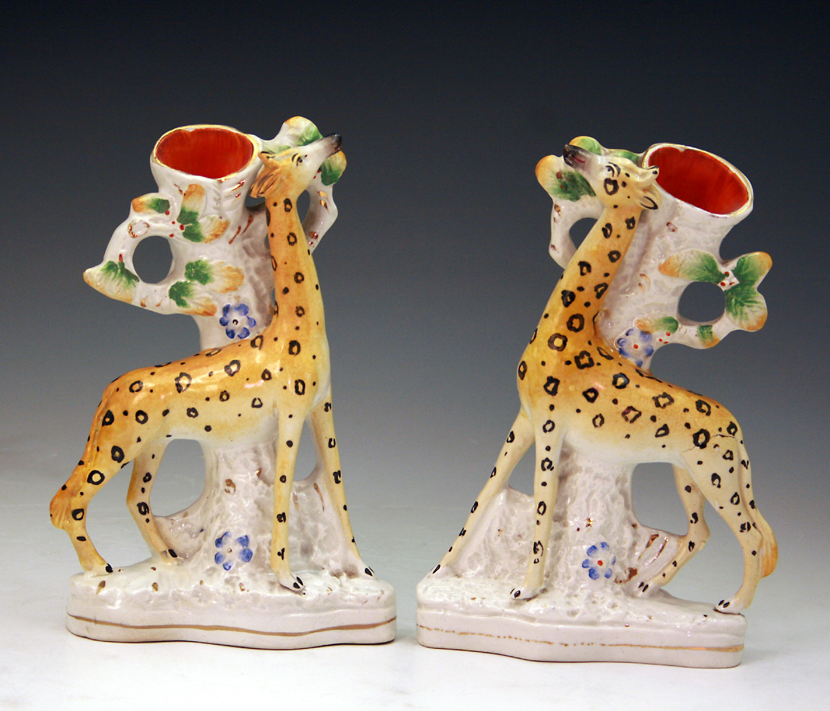 PAIR OF VICTORIAN STAFFORDSHIRE POTTERY FIGURES OF GIRAFFES