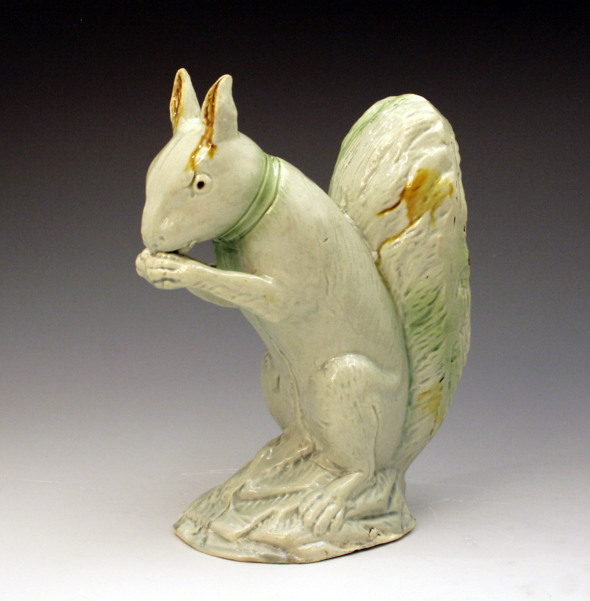 English pottery creamware coloured glazed figure of a Squirrell 18th century