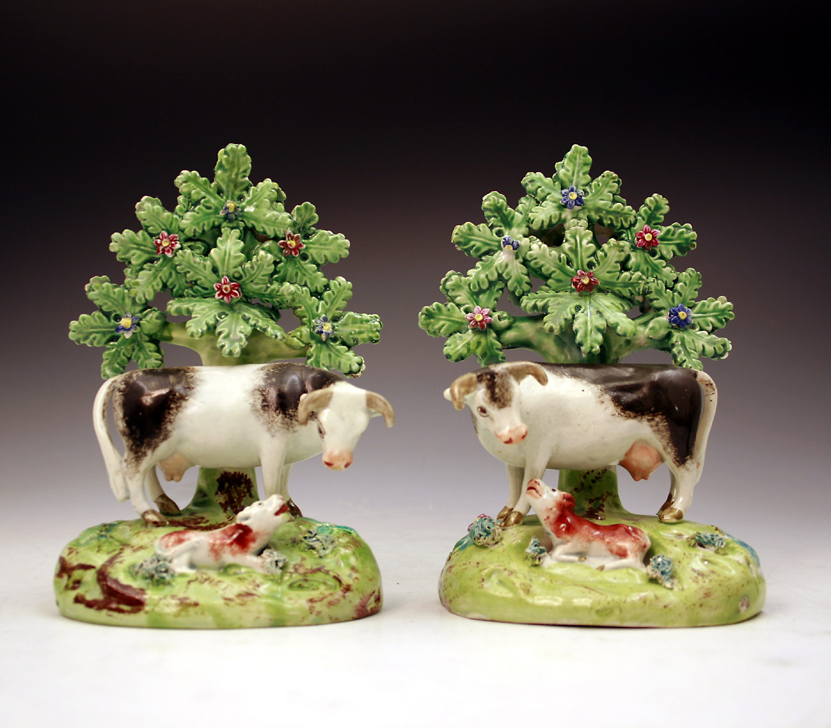 Antique English Staffordshire pottery pearlware figures of cows by Walton.