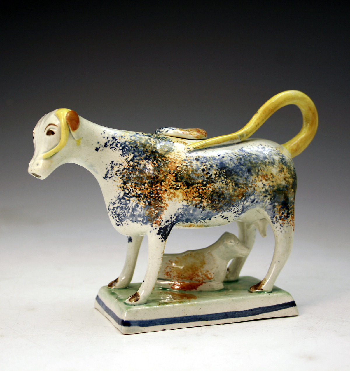 English pottery figure of a cow creamware with calf  c1800