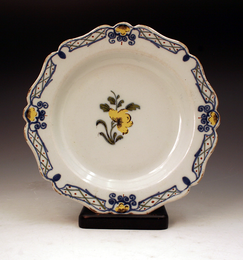 18th century Delft earthenware plate English or Irish decorated in polychrome colours. 
